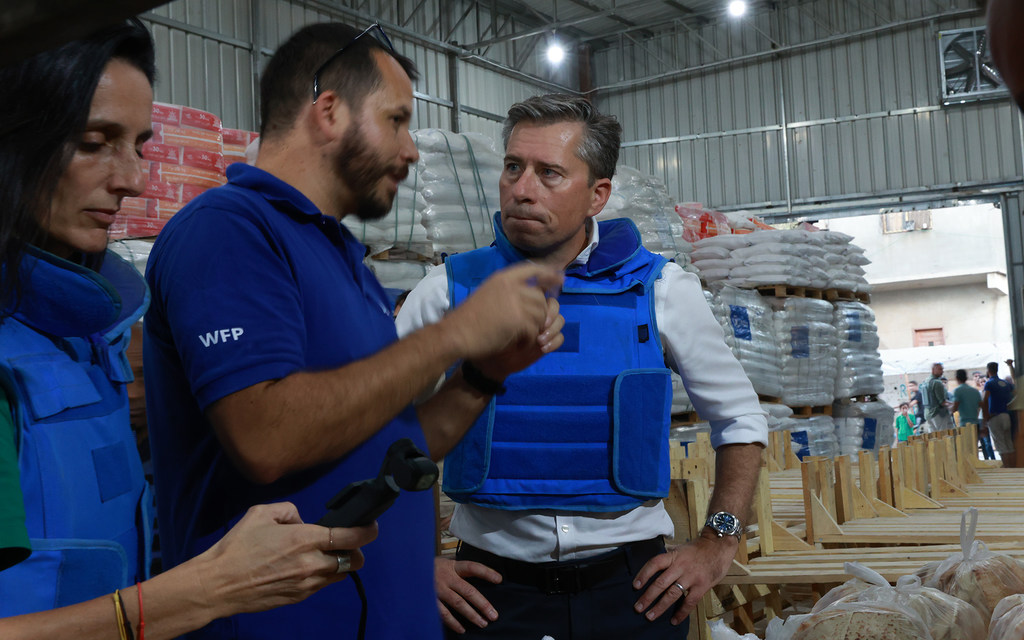 Tom Fletcher talks to a UN humanitarian worker shortly after entering Gaza on Friday.